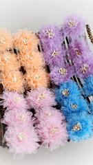 Handmade pastel flowers made out of tulle fabric flowers. This tulle fabric cloth blossom is great for handicraft DIY project collection.