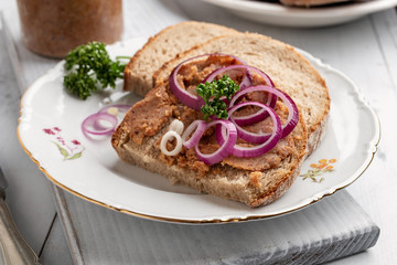 Slices of bread slathered with pork lard mixed with ground cracklings