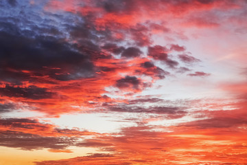 Fototapeta premium Beautiful dramatic red sunset sky with stormy clouds.