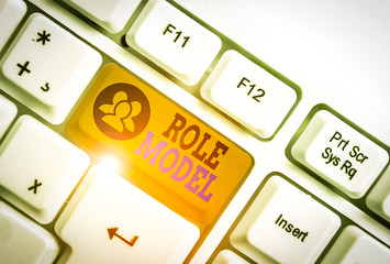 Writing note showing Role Model. Business concept for a demonstrating looked to by others as an...
