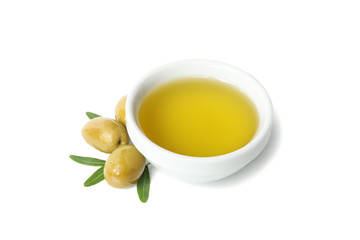 Bowl with olive oil, olives and leaves isolated on white background