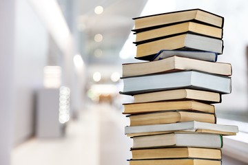 Collection stack of old retro books on hospital background