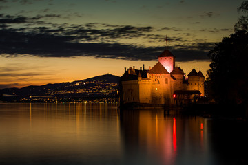 Sunset on a castle by a lake