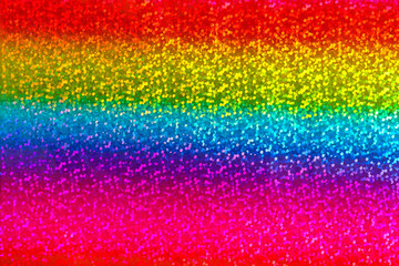 Seamless abstract glitter rainbow background of holographic paper