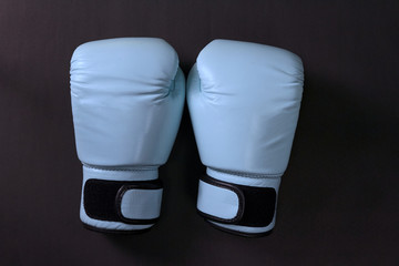 Boxing gloves on black background