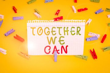 Handwriting text Together We Can. Conceptual photo unity can makes everything possible One powerful group Colored clothespin papers empty reminder yellow floor background office