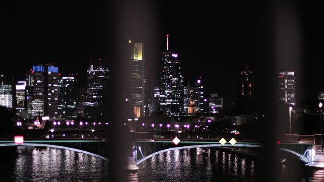 A walking view of night sky and skyline of Frankfurt. Glowing lights pink globes everything in Frankfurt is absolutely fantastic and lovely all around.