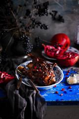 Obraz na płótnie Canvas quail in pomegranate sauce. rustic photo