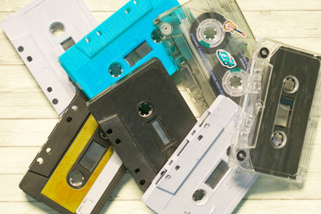 Old cassette tapes with a wooden background