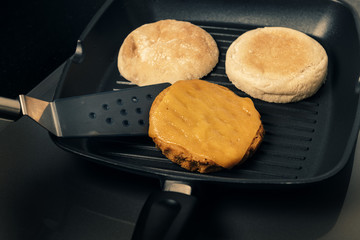 vegan burger with cheese and bread cooking