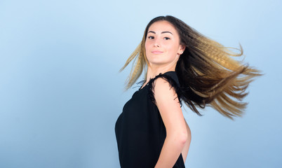 Fototapeta premium Voluminous crimped hair. Curling and crimping hair. Hairdresser styling tips. Nice and easy. Trendy crimped hairstyle. Fashion girl stylish hairstyle. Hair crimping method styling hair become wavy
