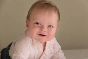 Portrait of a cute 9 months cheeky boy