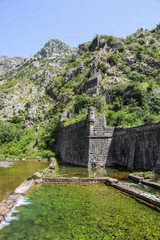 Fototapeta na wymiar Walls old fortress of Kotor abruptly climbing uphill. Kotor, Montenegro