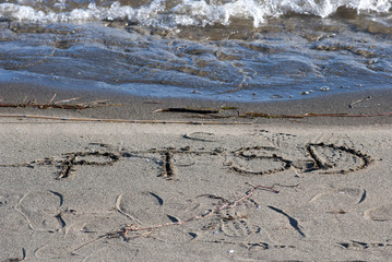 ptsd text on a beach sand