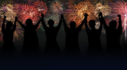 Silhouette of group business team making high hands over head on firework background - Powered by Adobe