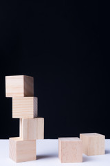 Financial risk assessment, risk reward and portfolio risk management concept. Blocks of wood cubes arranged creatively to depict the concept.