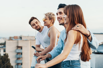 Group of friends enjoying outdoors at roof