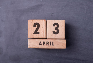 April 23 written with wooden blocks