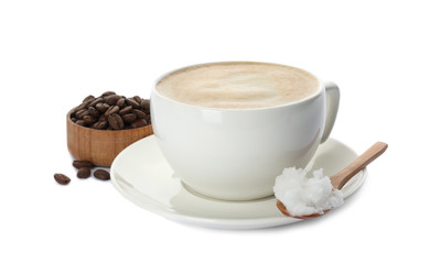 Delicious coffee with organic coconut oil and beans isolated on white