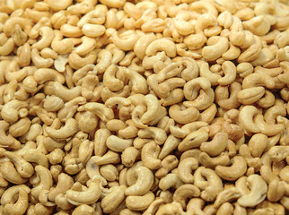 Roasted cashew nuts with honey sugar. Tasty sweet cashew nuts as textured and background.