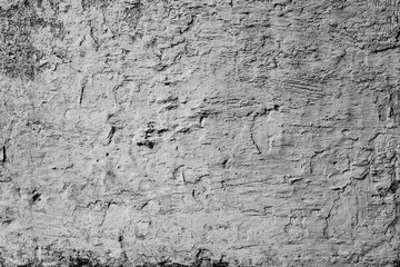 Texture of a concrete wall with cracks and scratches which can be used as a background