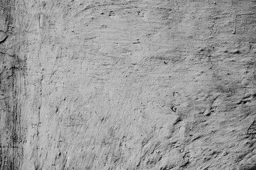 Texture of a concrete wall with cracks and scratches which can be used as a background