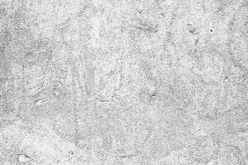 Fototapeta premium Texture of a concrete wall with cracks and scratches which can be used as a background