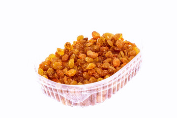 Dried raisins on white background. Tasty and healthy berry.