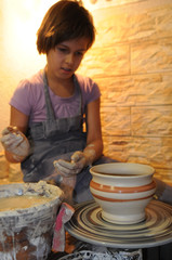 Girl admires her ceramics