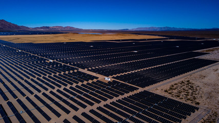 Aerial photos of Solar Farm in Desert with mountains in background