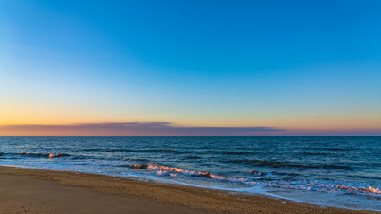 Sea beach in sunset colors