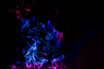 colorful smoke on dark background.abstract background from smoke