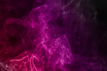 colorful smoke on dark background.abstract background from smoke