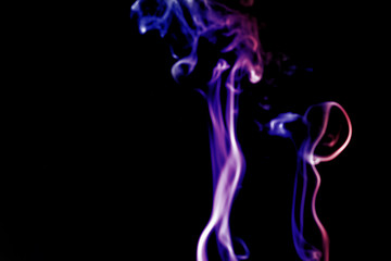 Obraz premium colorful smoke on dark background.abstract background from smoke