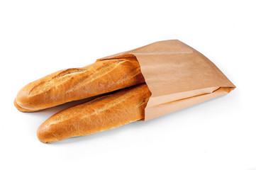 Baguette bread in paper bag on white background