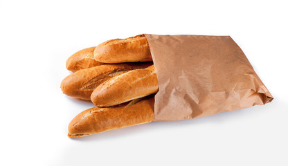 Baguette bread in paper bag on white background