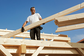 Carpenter at Work, Unloading Rafters for a Timber Roof Truss