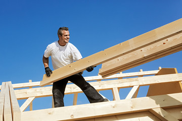 Carpenter at Work, Unloading Rafters for a Timber Roof Truss