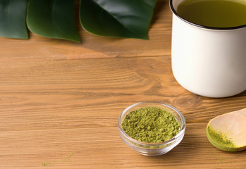 matcha dry next to a mug of ready tea. have copy text