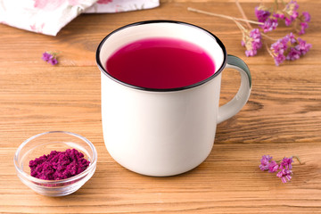 pink matcha tea on a wooden background in a circle. rustic concept