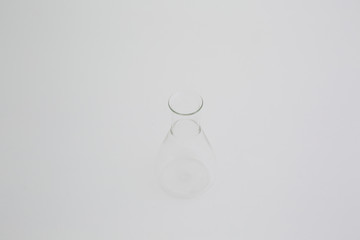 Scientific laboratory glass erlenmeyer flask isolated on white background