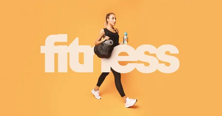 Photo sur Aluminium Fitness Big fitness inscription over girl going to gym