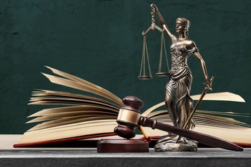 Sculpture justice bronze lady and open books and gavel