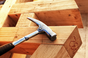 Prefabricated Piece of a Roof Structure and Hammer