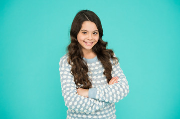 Fototapeta premium Childhood and girlhood. International childrens day. Child care. Happy childhood. Beautiful kid. Emotional girl. Little girl blue background. Smiling small girl with long hair. Beauty and health