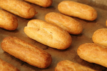 Freshly baked choux pastry. Making Eclair.