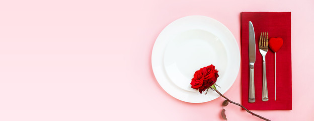 Romantic table setting for Valentines day or dinner date celebration wedding.