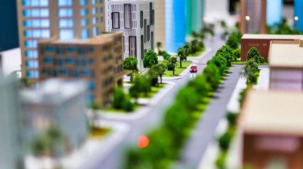 modern generic contemporary style miniature model of glass buildings and streets with tilt-shift...