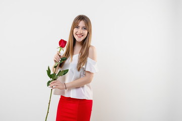 woman with red rose smiling isolated on white background