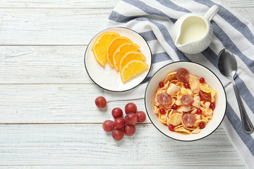 Tasty healthy breakfast served on white wooden table, flat lay